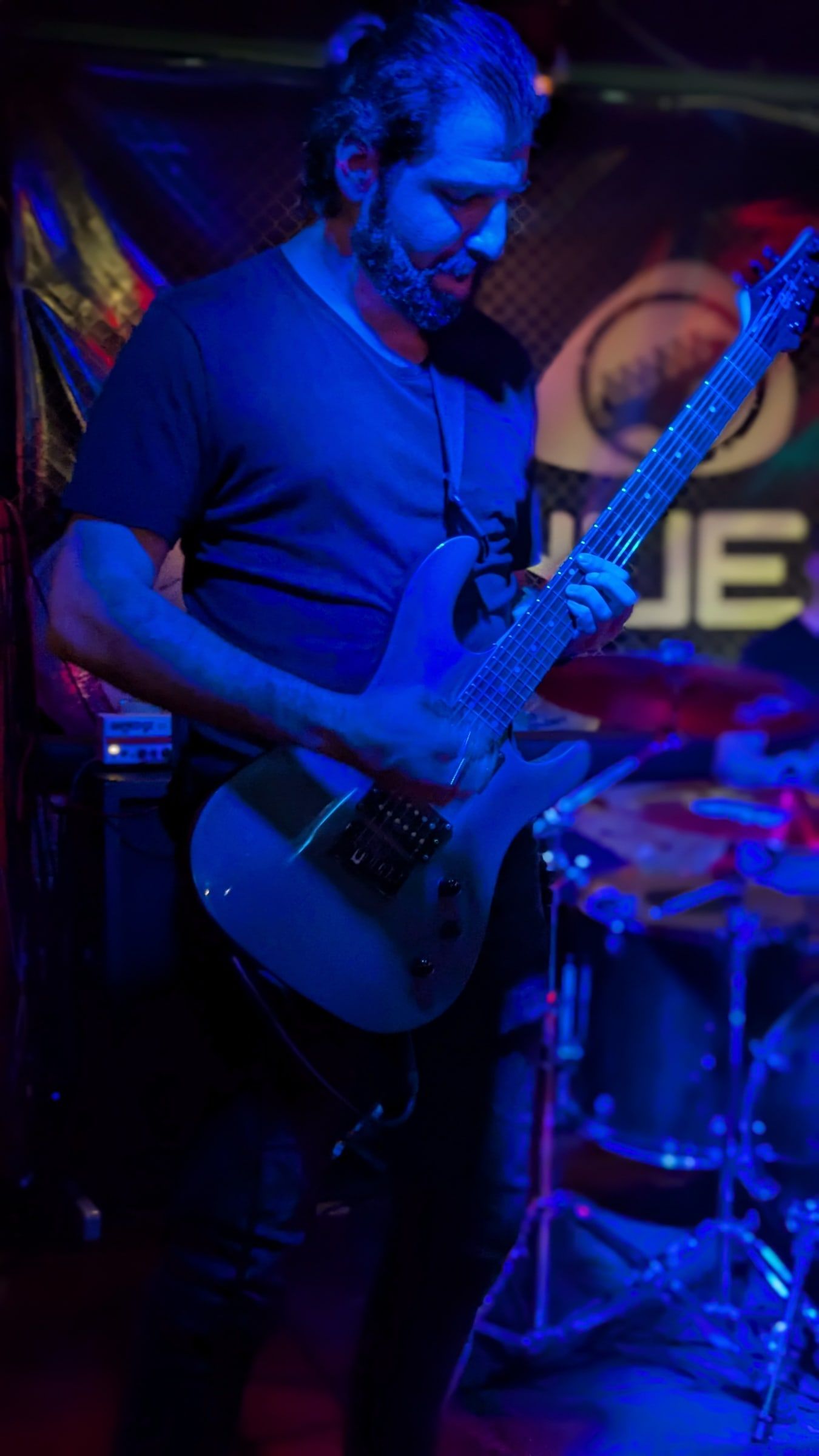 Guitarist under blue stage light